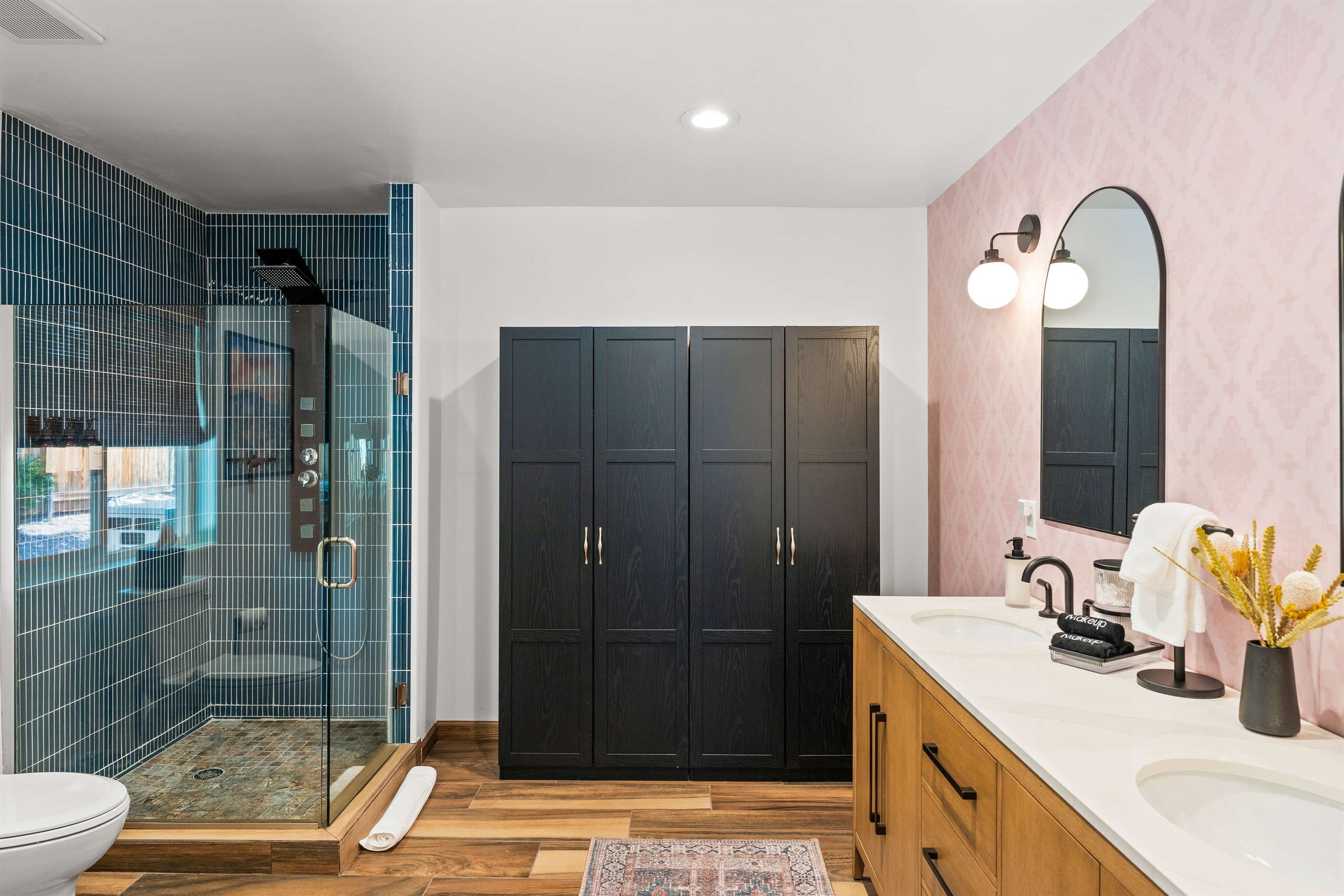 Spacious bathroom with modern double vanity and upgraded shower head for a relaxing retreat.