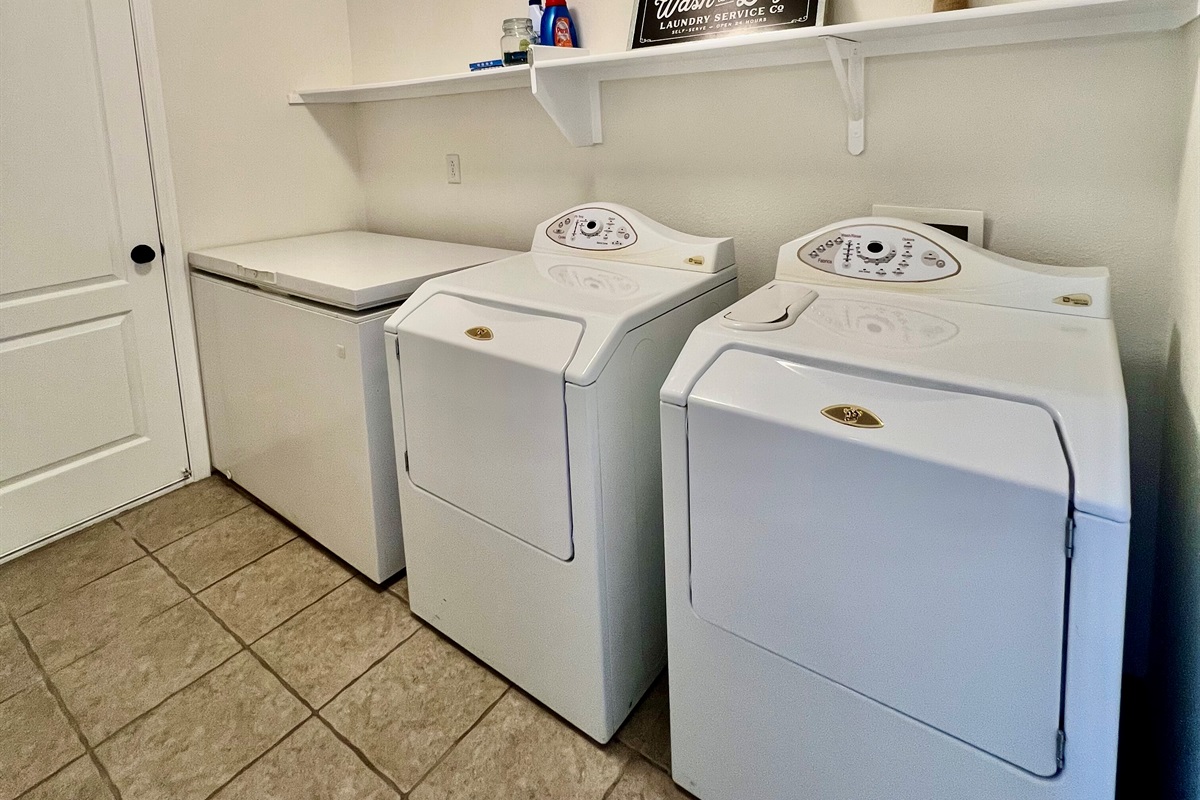 Enjoy the convenience of a private laundry room with a full-size washer and dryer