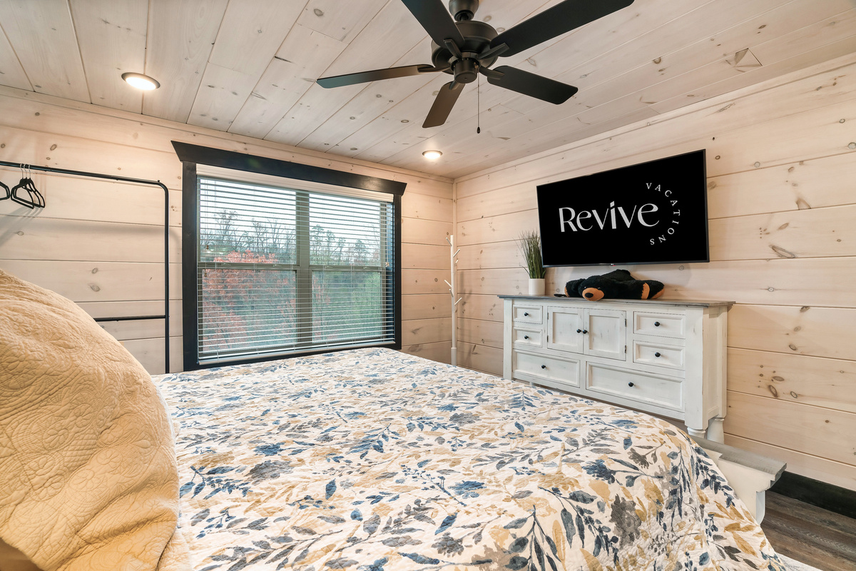 King bedroom featuring a 50" TV for relaxing evenings.
