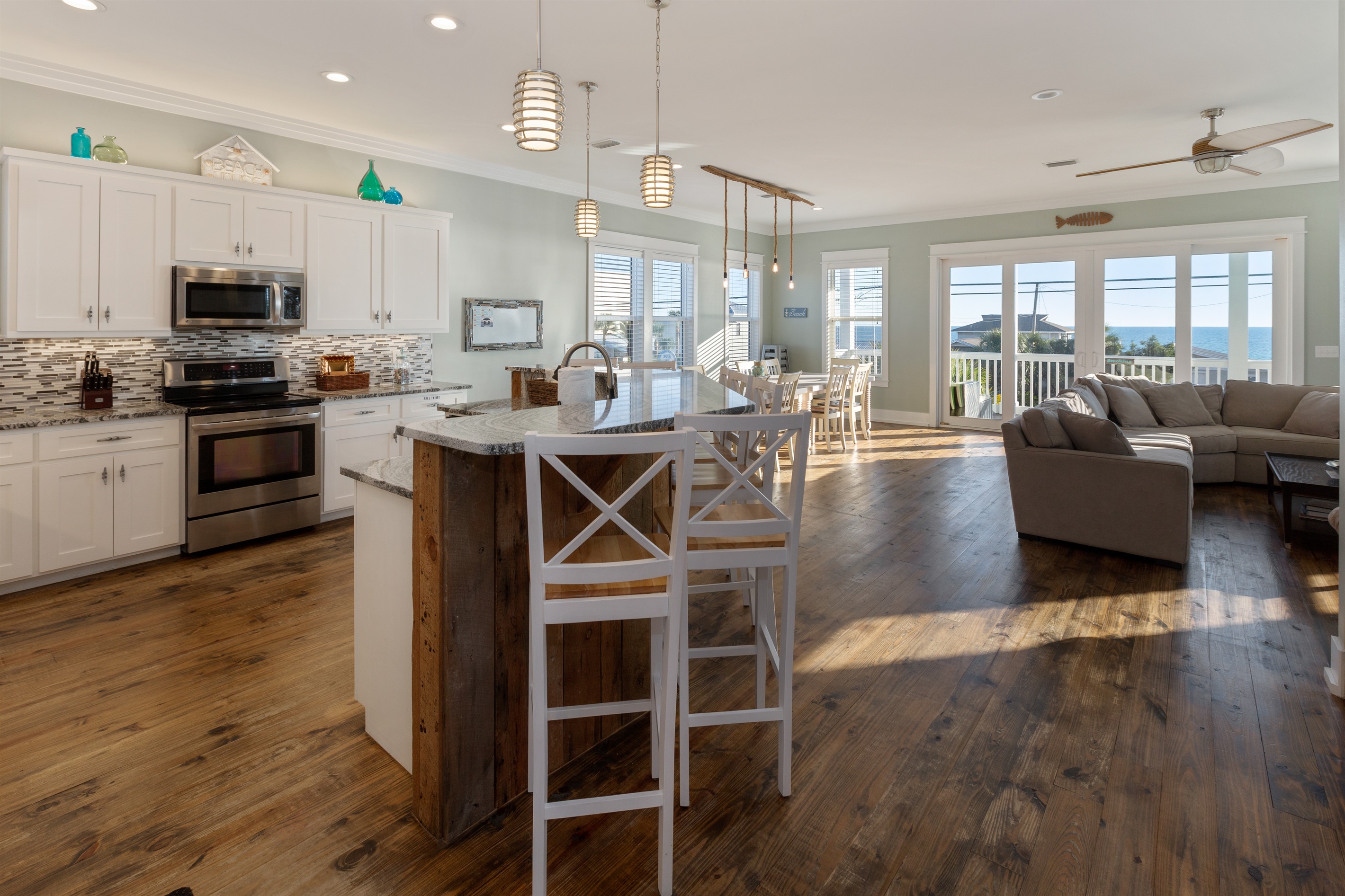 Second floor kitchen, living room dining room with stunning views allow ample space for everyone to enjoy time together.