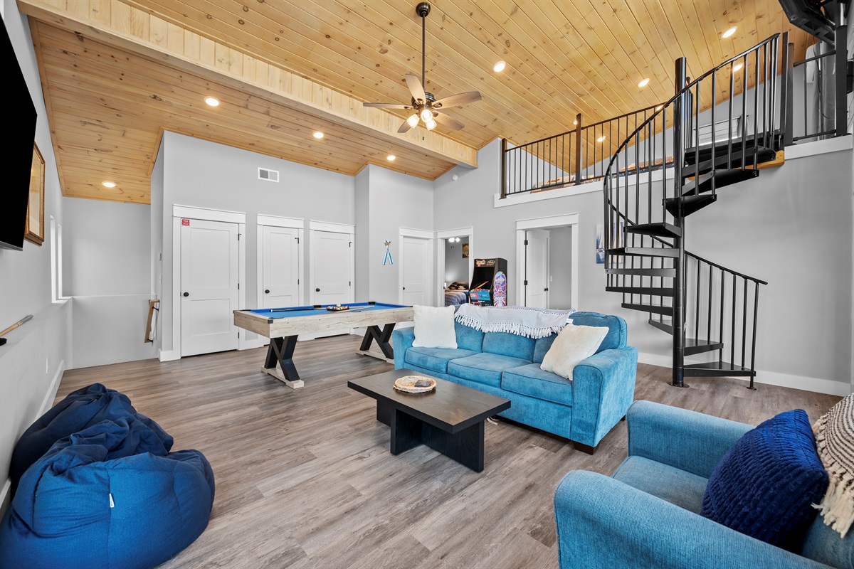 Wide view of the main living and game room area—ideal for entertaining, relaxing, and spending time together without feeling crowded.