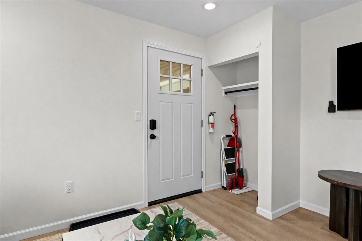 Clean, welcoming entryway with modern finishes, smart lock access, and convenient storage—making arrivals smooth, organized, and stress-free.