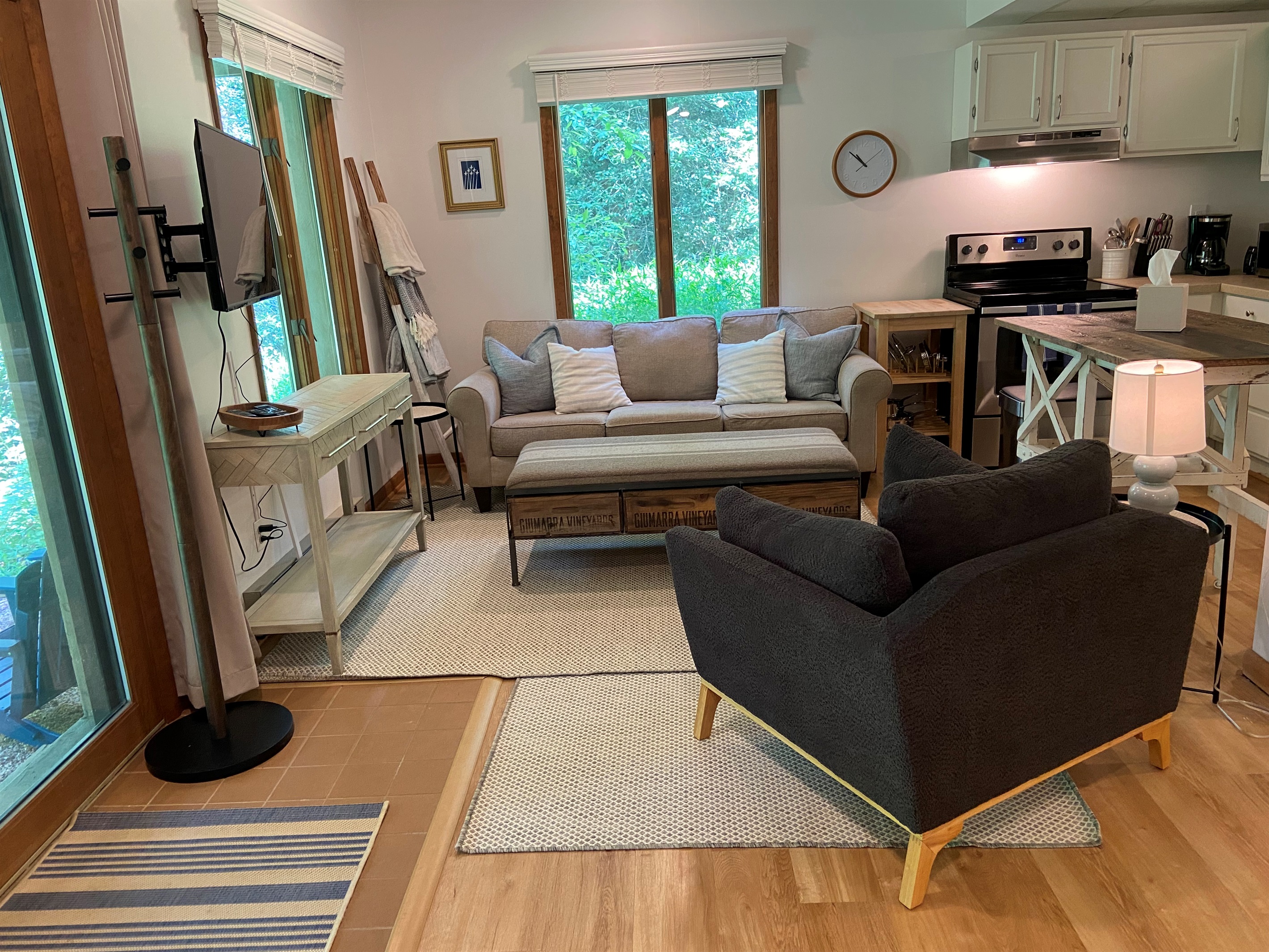 Living room includes comfortable seating for four.