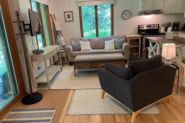 Living room includes comfortable seating for four.