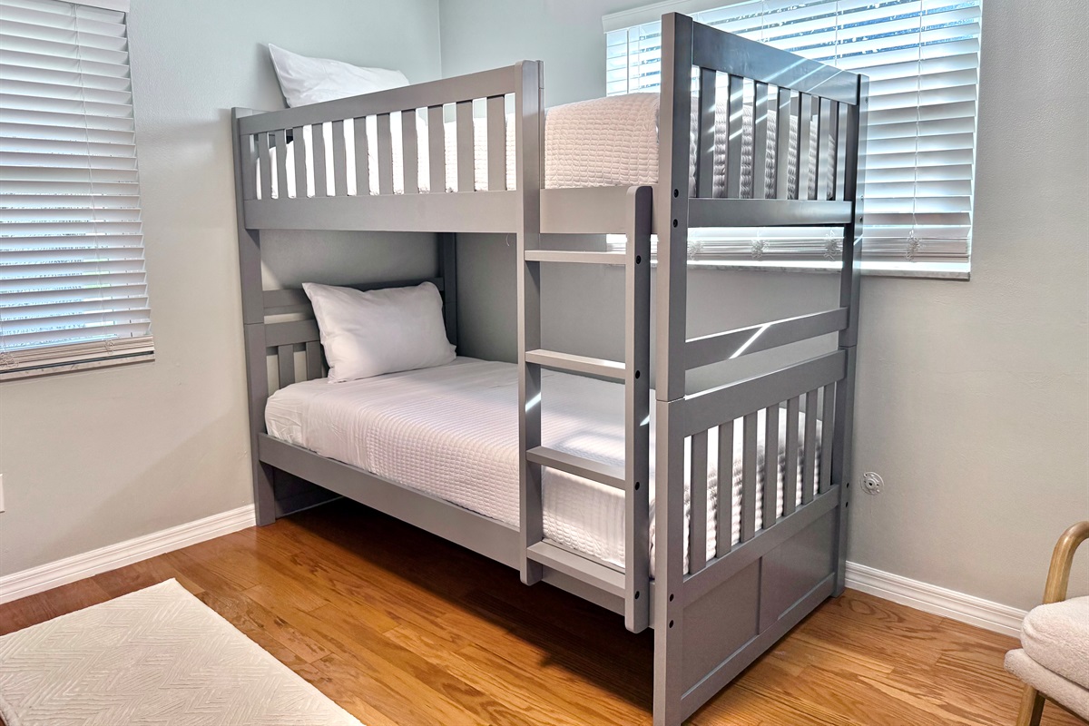 Designed with families in mind, this playful room offers cozy sleeping arrangements for up to four guests.