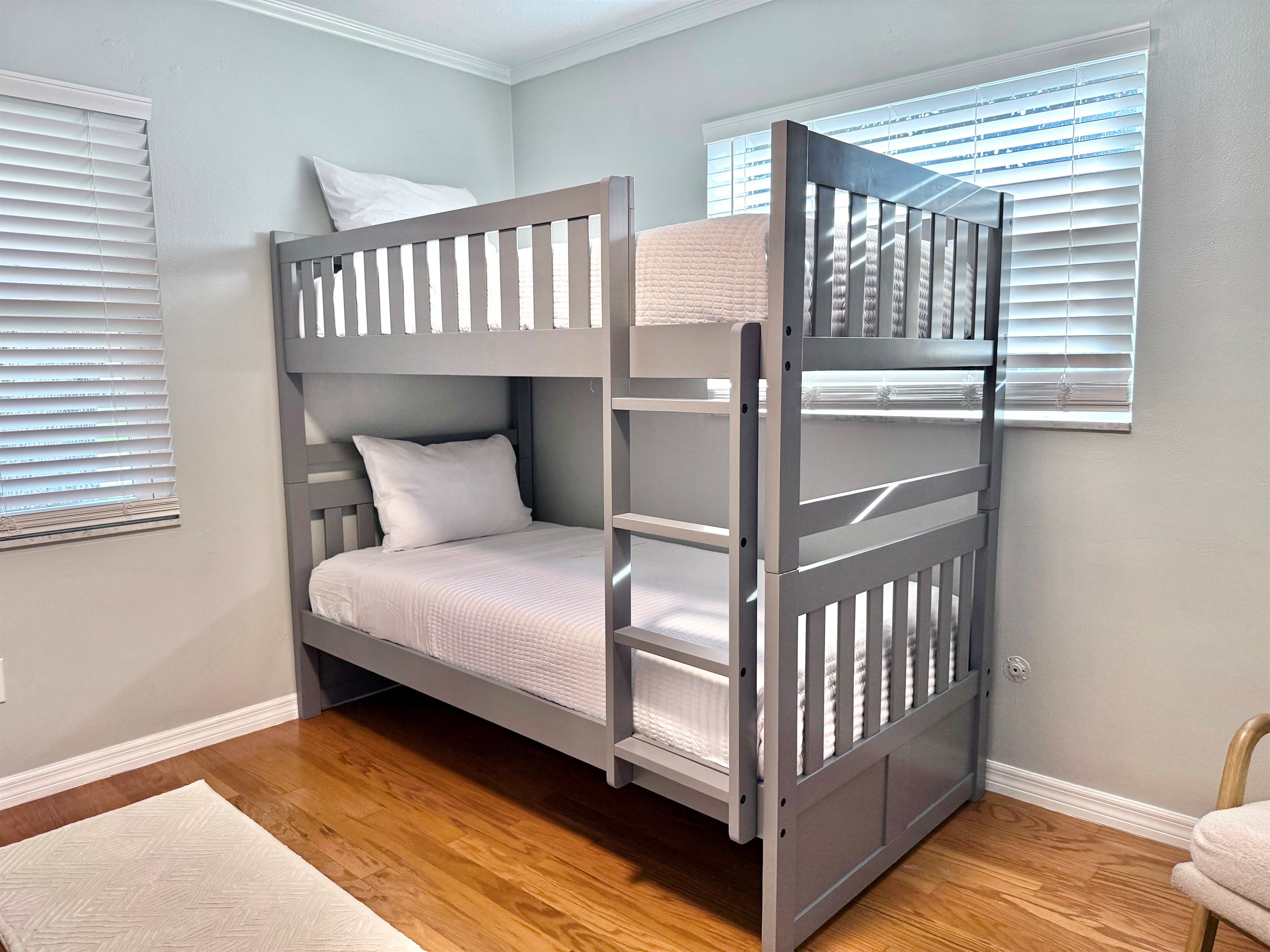 Designed with families in mind, this playful room offers cozy sleeping arrangements for up to four guests.