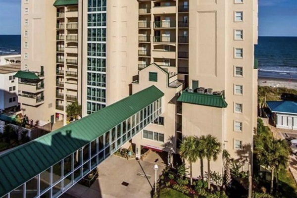 A view of the Windy Hill Dunes Building from the parking garage with the skypath giving you easy access to get from your car to the condo.