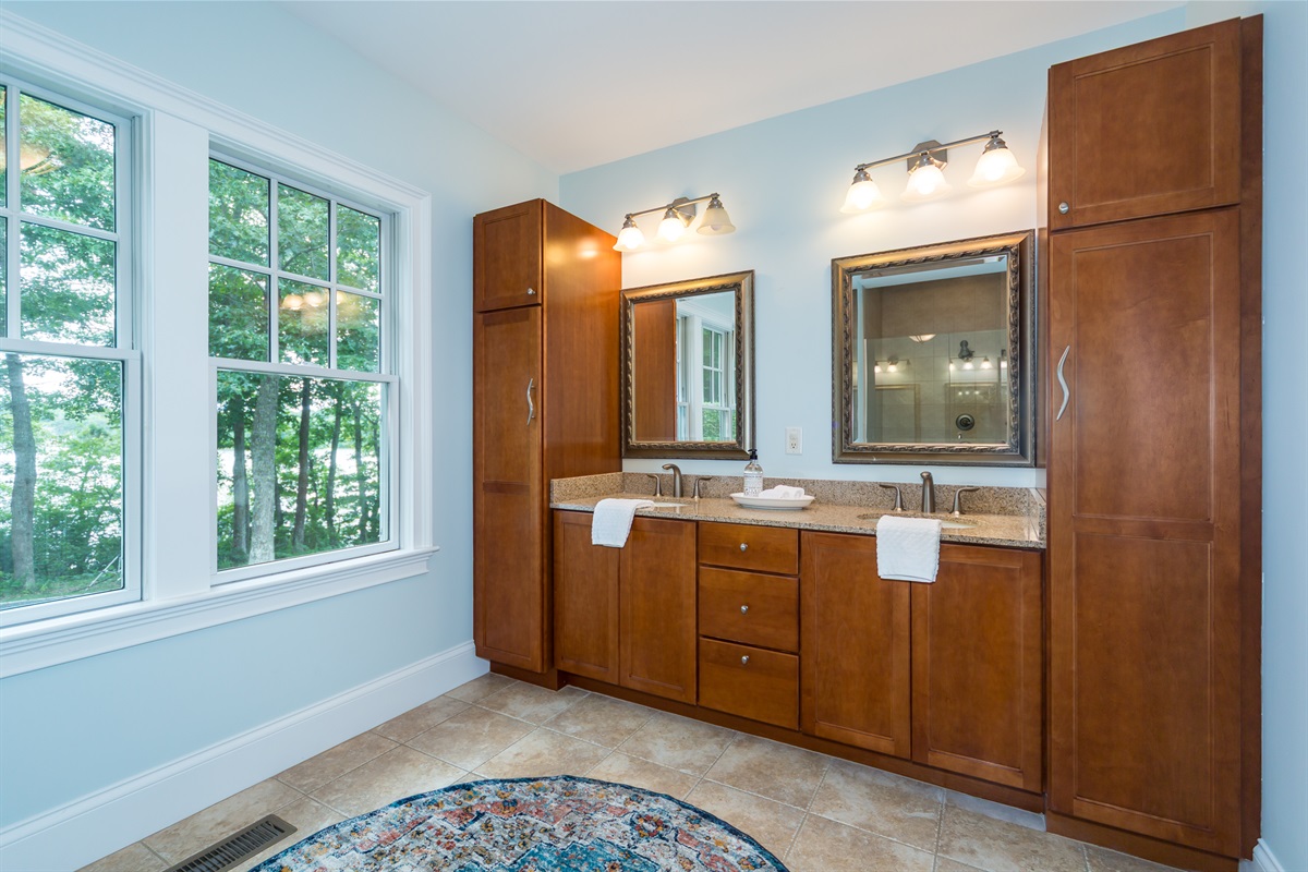 A roomy layout with double vanities, perfect for couples or friends sharing the space.