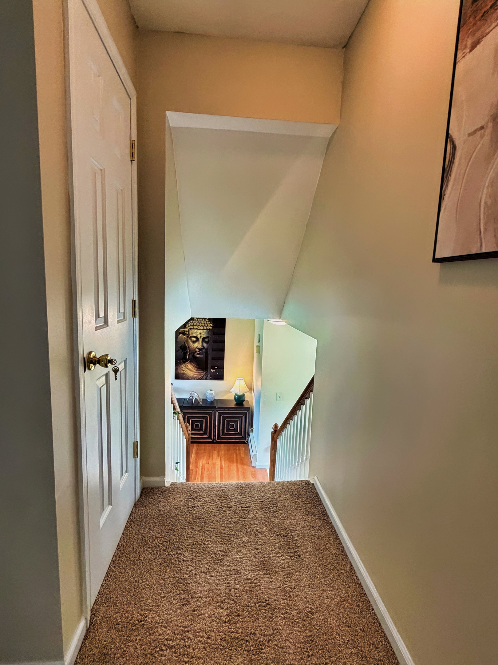 Stairs from 2bd floor going down to the 1st.