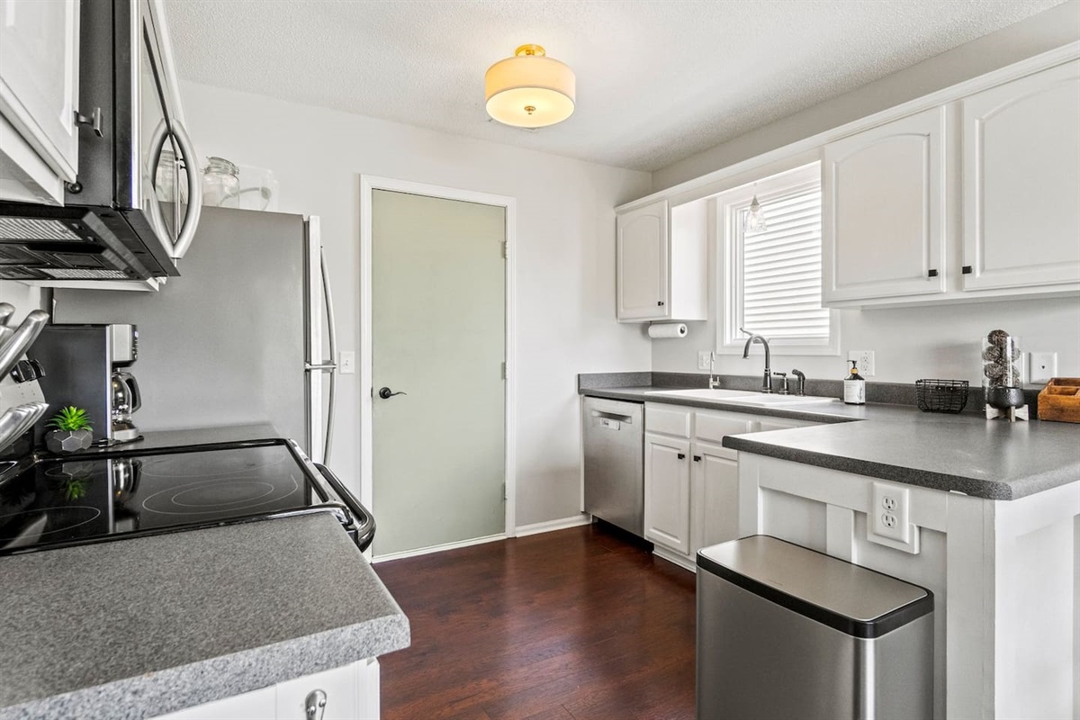 From the dishwasher to the trash bin, this kitchen is thoughtfully arranged for convenience and efficiency.