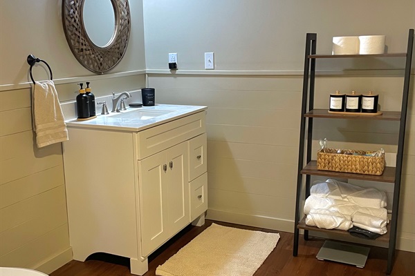 Spacious bathroom with walk-in shower and fresh towels for your stay