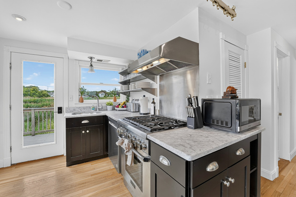 Functional kitchen with generous counters and an open design that keeps everyone connected while cooking and gathering.