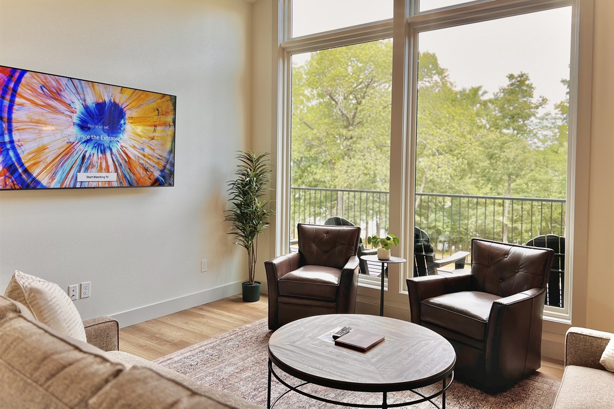 Upstairs living room with large windows for the best viewsn and Smart TV
