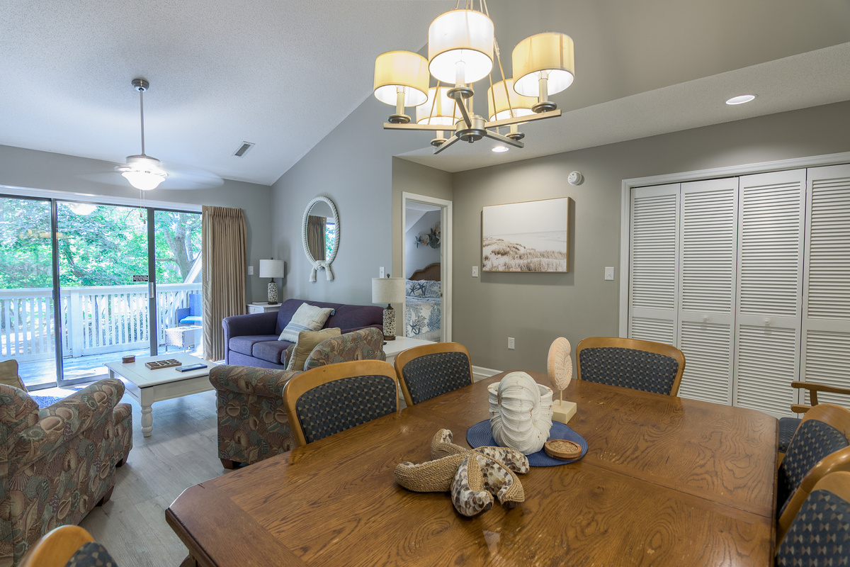 Open concept living room/dining room area with seating for 8