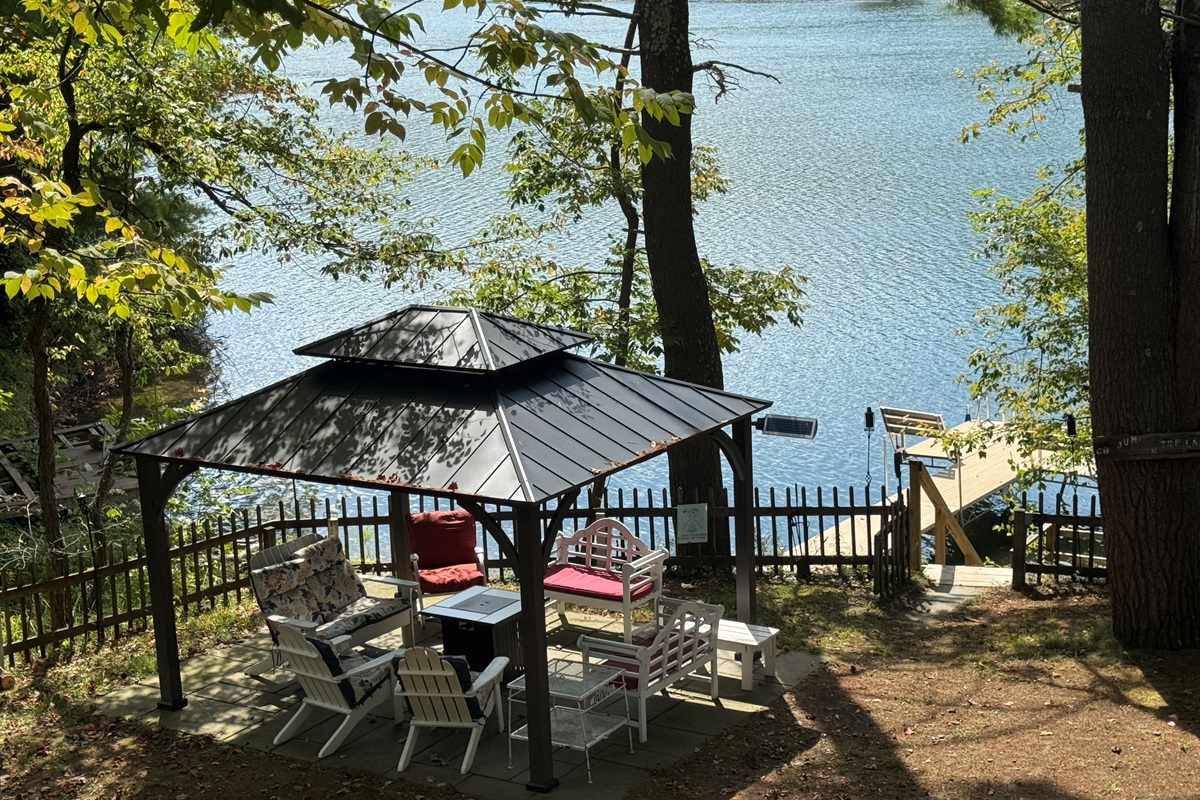 Seating area around fire pit above the water