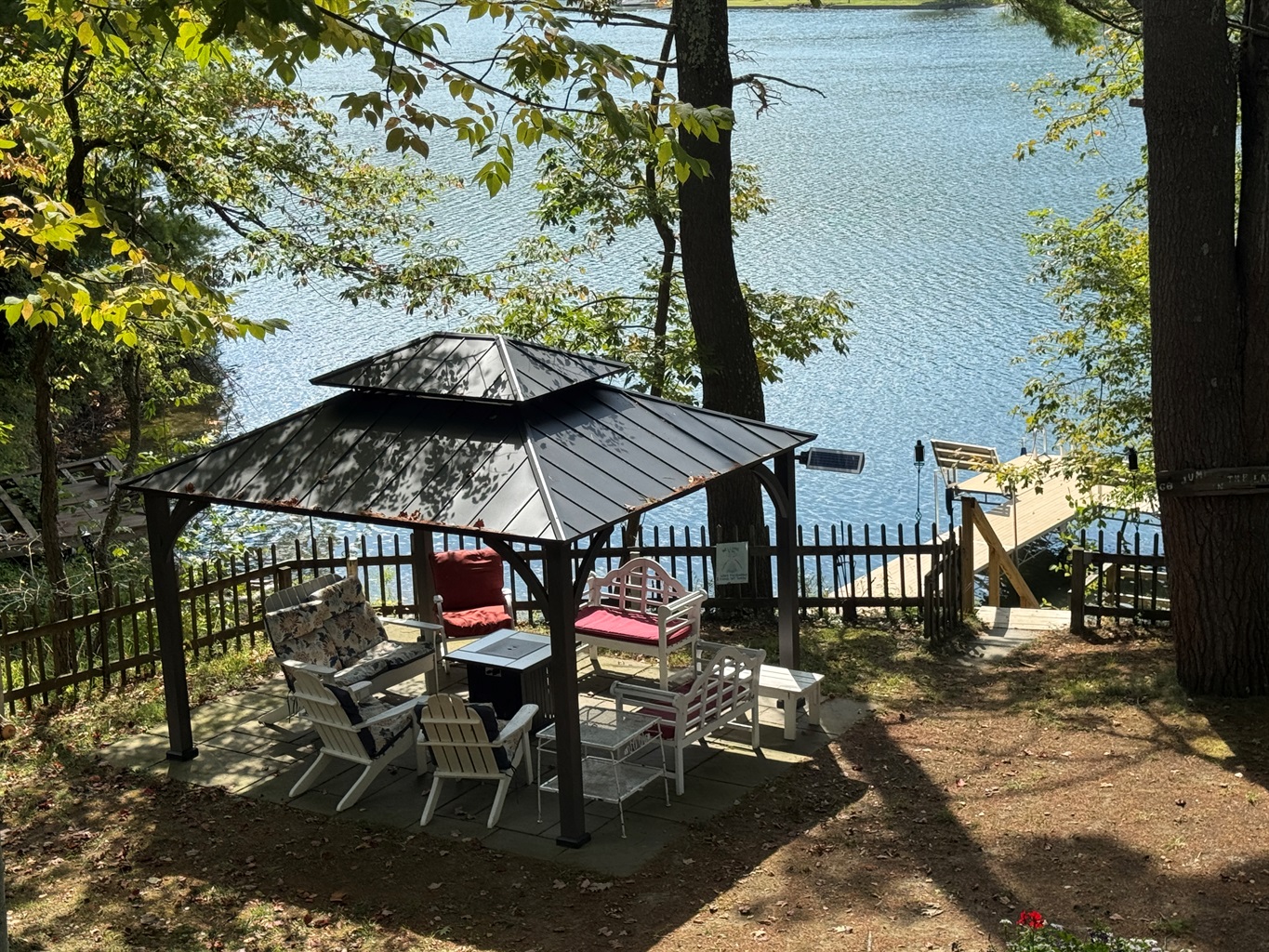Seating area around fire pit above the water