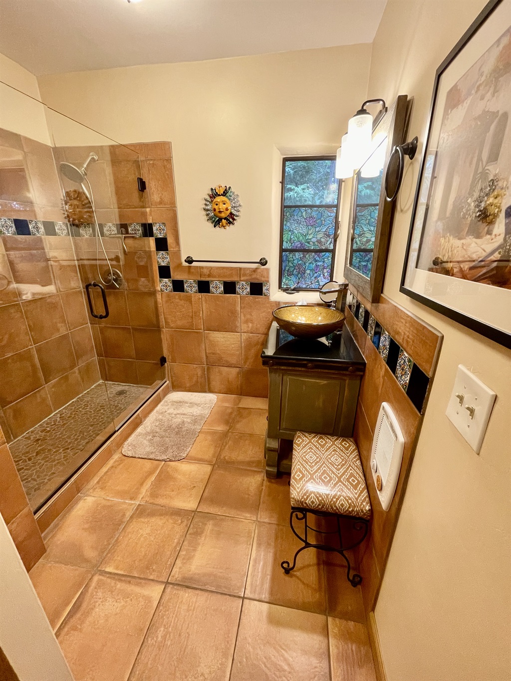 Relax and rejuvenate in this beautifully remodeled bathroom.