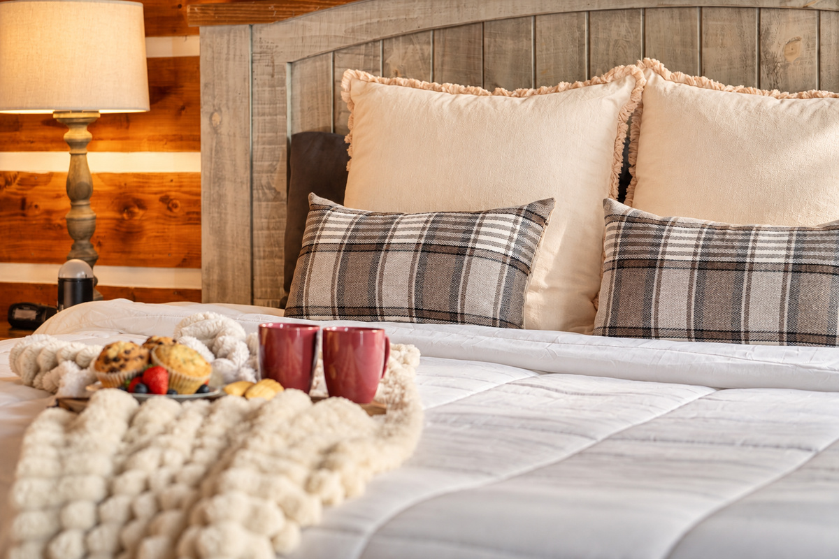 Share coffee and warm muffins for two, propped up on plaid pillows.