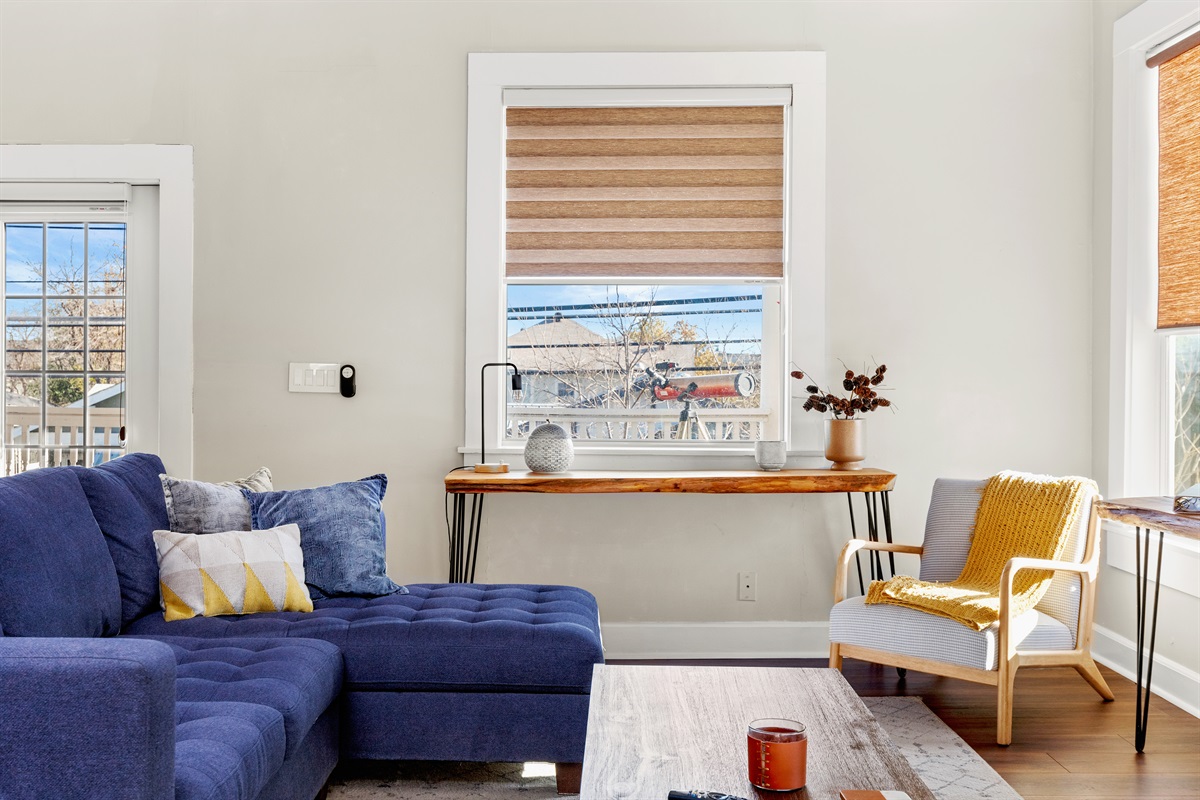 In the heart of relaxation, this living room invites you to sink into the plush sofa, immerse yourself in the screen's magic, and unwind in style