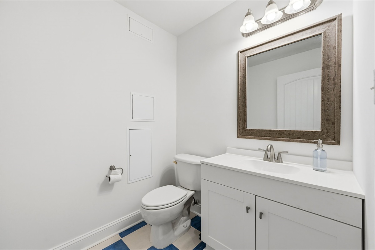 Convenient ground-floor half bath perfect for quick refreshes after beach days