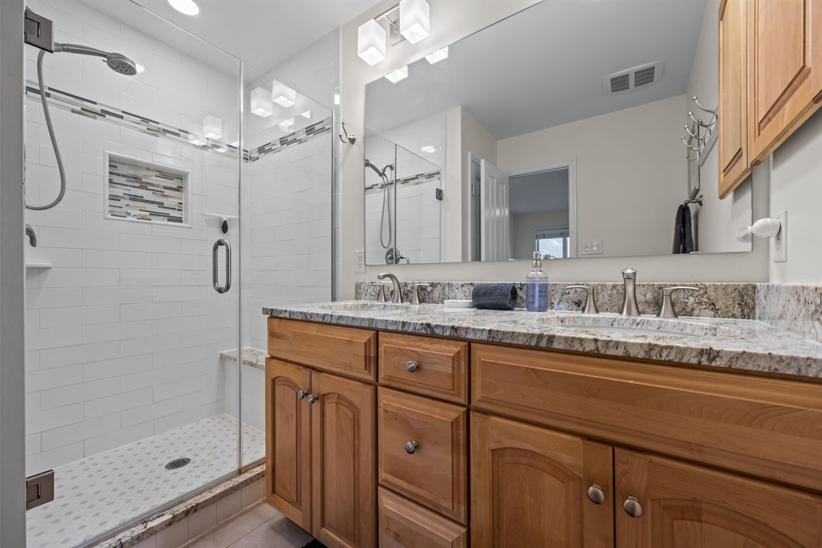 Modern 1st floor bathroom with double vanity and walk-in shower