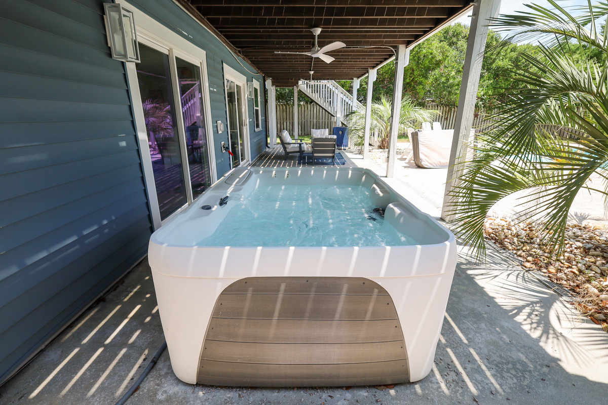 Unwind in the private hot tub after a day at the beach or pool
