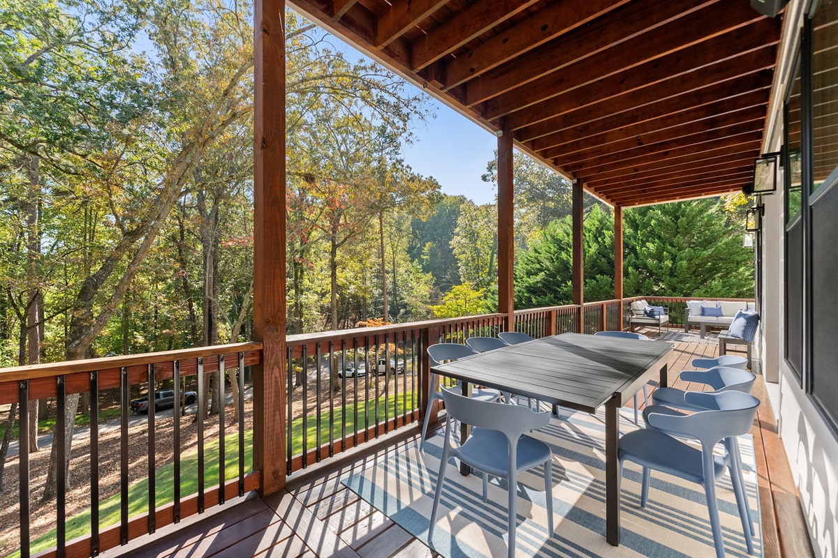 Upper deck dining area with views — dine al fresco in comfort.
