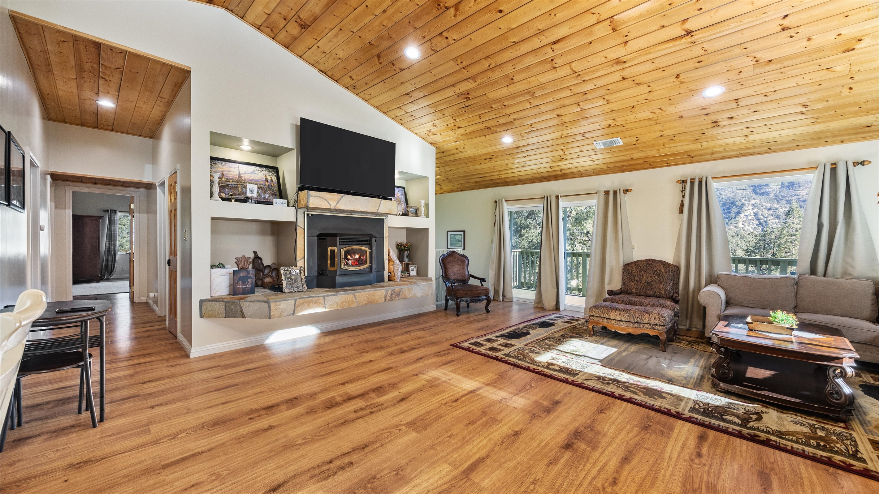 Large windows flood the living room with natural light and frame truly breathtaking views.