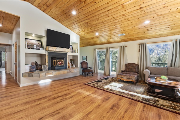 Large windows flood the living room with natural light and frame truly breathtaking views.