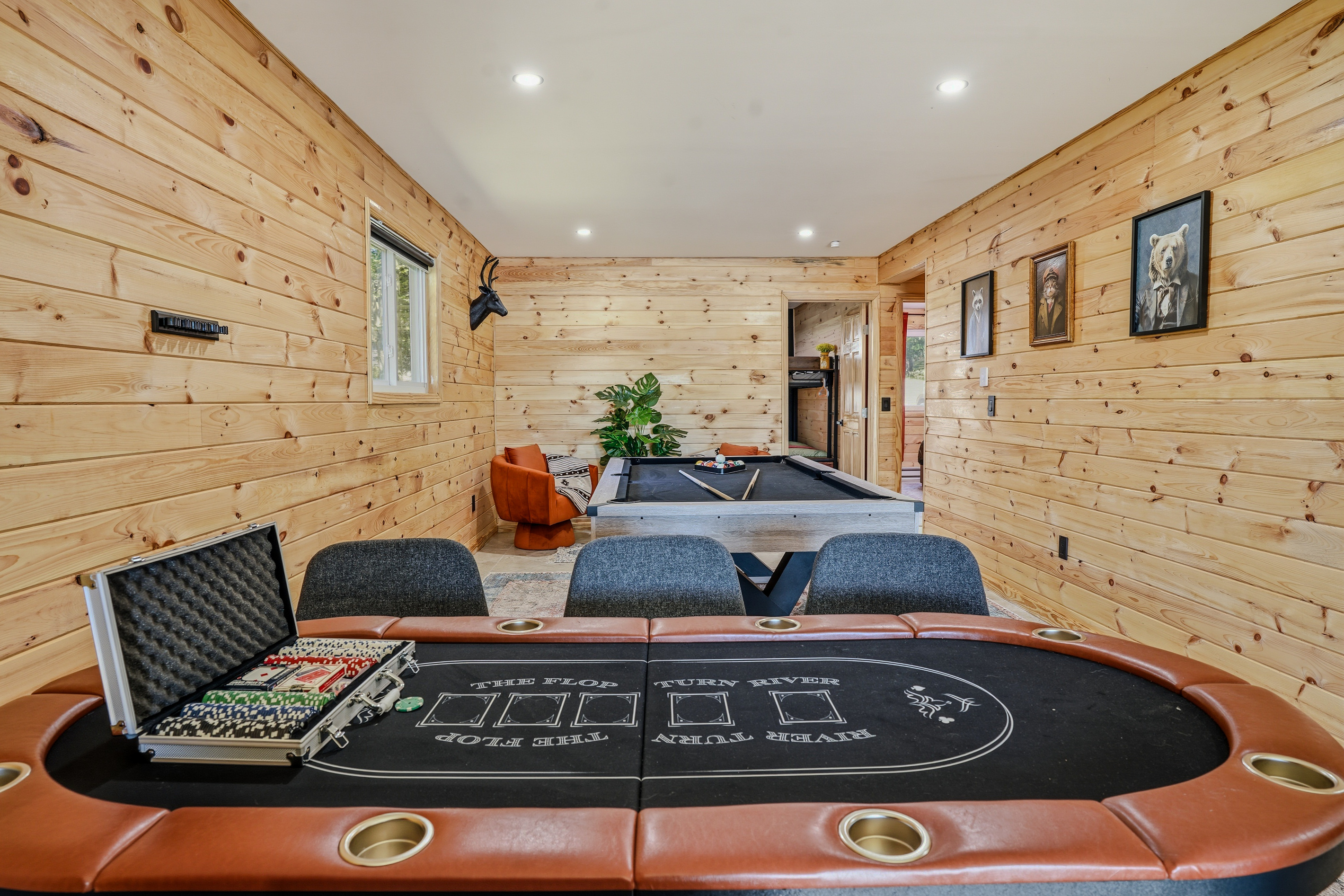 Poker table ready for game night — full felt surface, chips set, seating for six