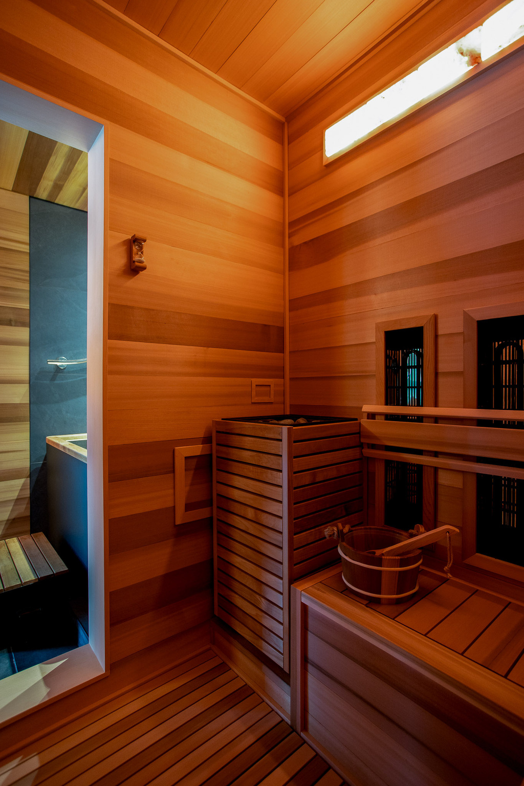 Interior of the cedar infrared sauna at Sunset Falls &mdash; Finnmark Spectrum Plus panels, ladle and bucket &mdash; Berkshires