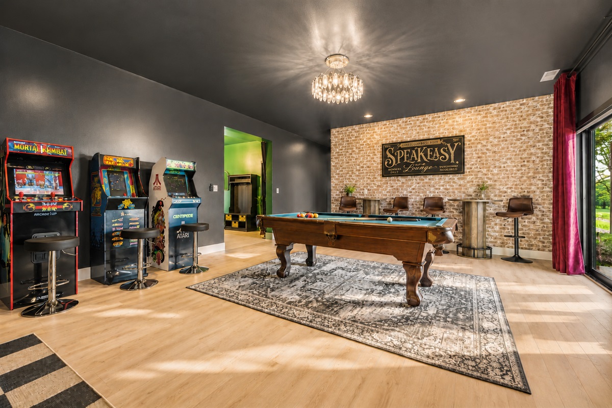{Speakeasy Game Room} Bounce between arcade classics, pool, and the bar — a full speakeasy-style experience built for groups to spread out and stay entertained.