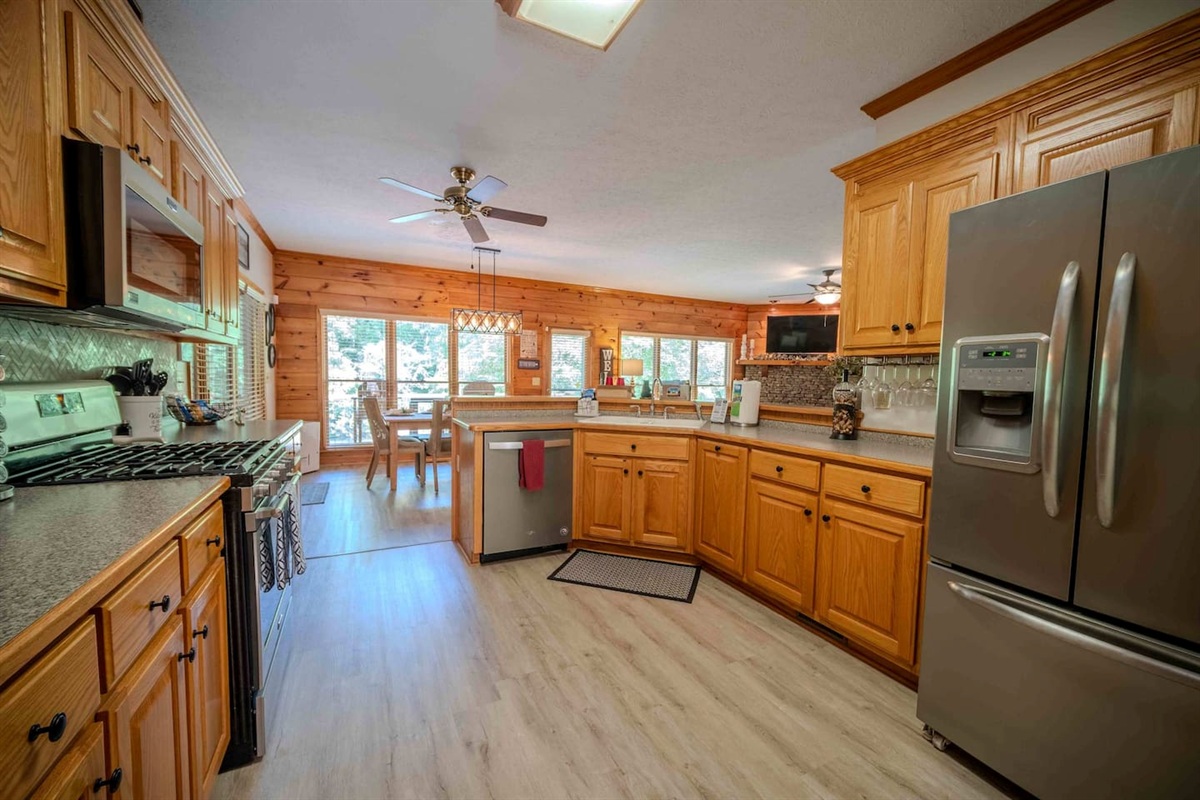 Fully Stocked Kitchen | Dinnerware | Silverware | Stove | Microwave | Full Size Refrigerator | Dishwasher | Pots and Pans | Instapot | Crockpot | Blender