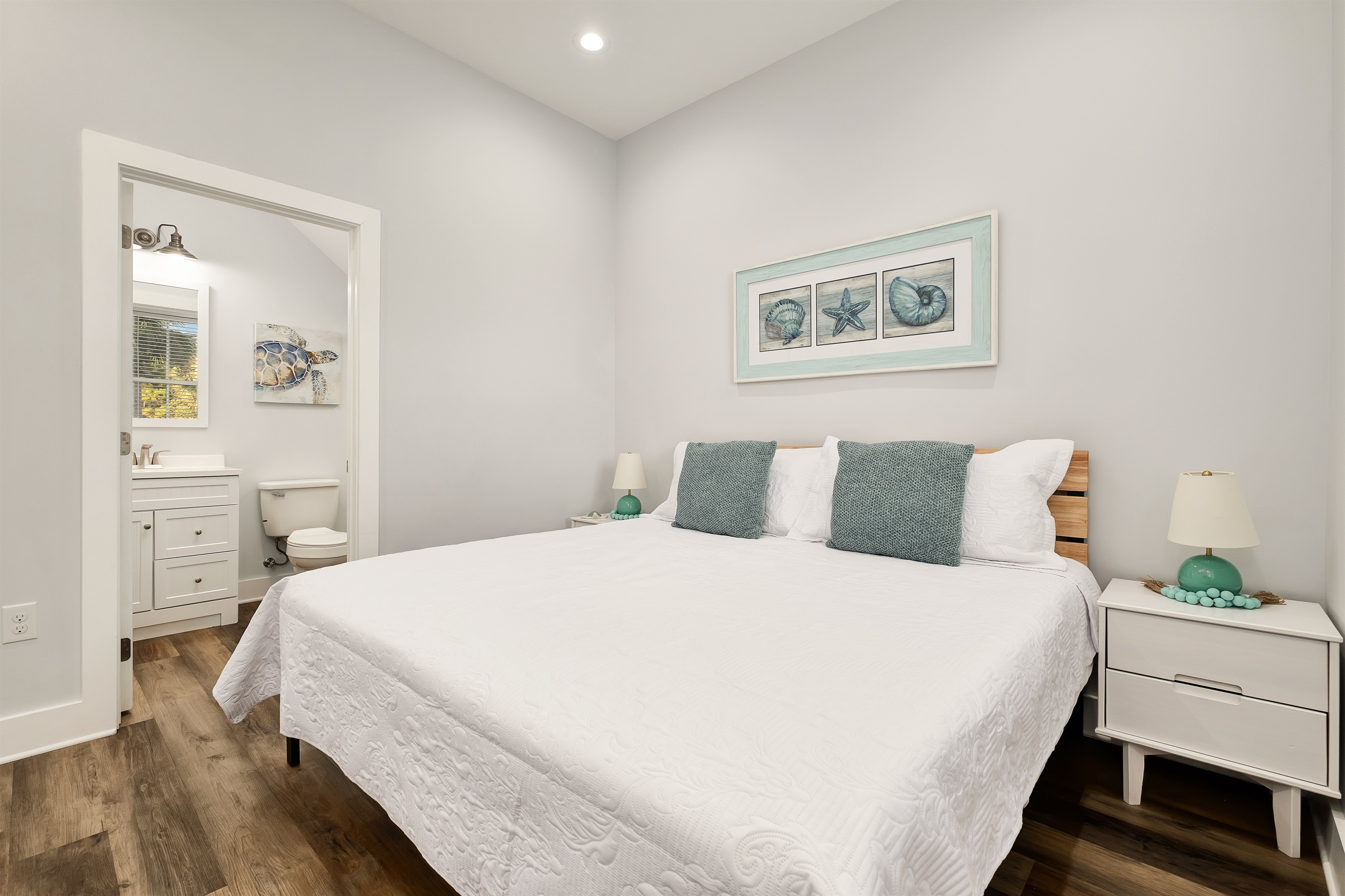 Bedroom #1  has a King-size bed, a dresser, and a TV. It’s cozy and comfortable, and has its own bathroom with a shower.