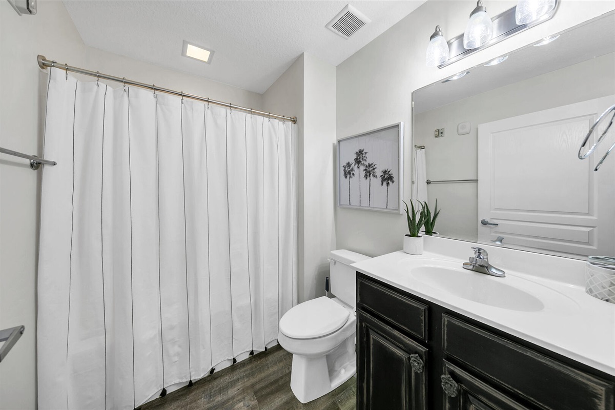 Guest Bath located next to guest bedroom & kitchen.