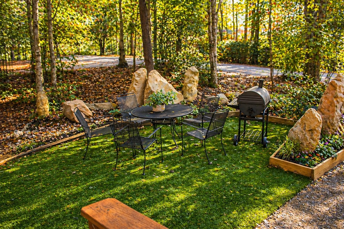 Private outdoor dining under the trees—grill, gather, and enjoy peaceful woodland views right outside your cabin.