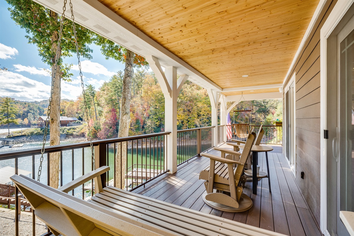 2nd floor covered porch with swing and swivel glider rockers