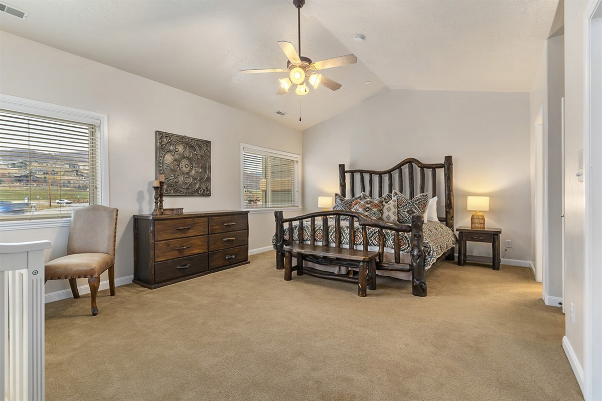 A bright and expansive primary suite filled with natural light, offering a peaceful and luxurious retreat.