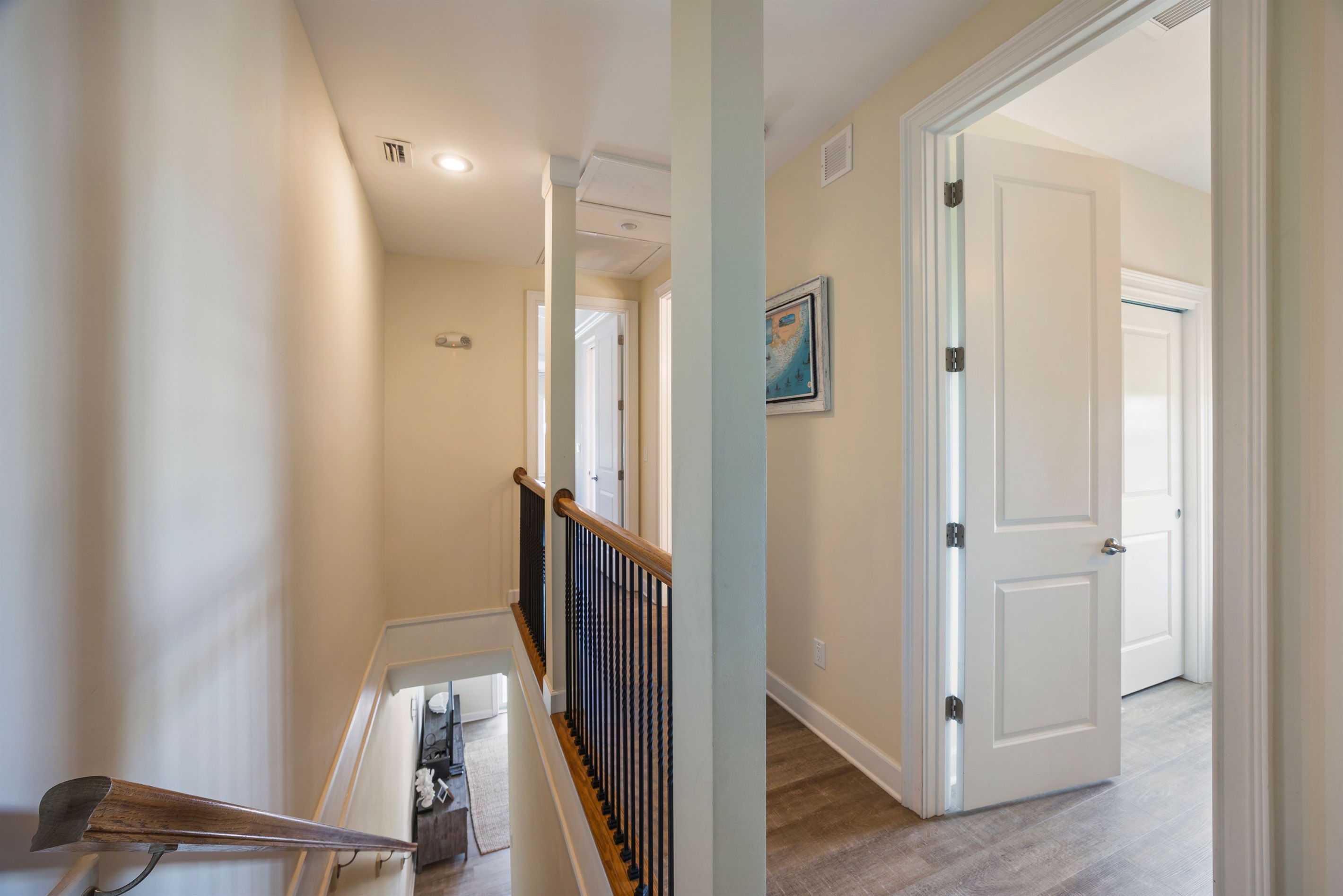 Hallway leading to stairs and bedrooms