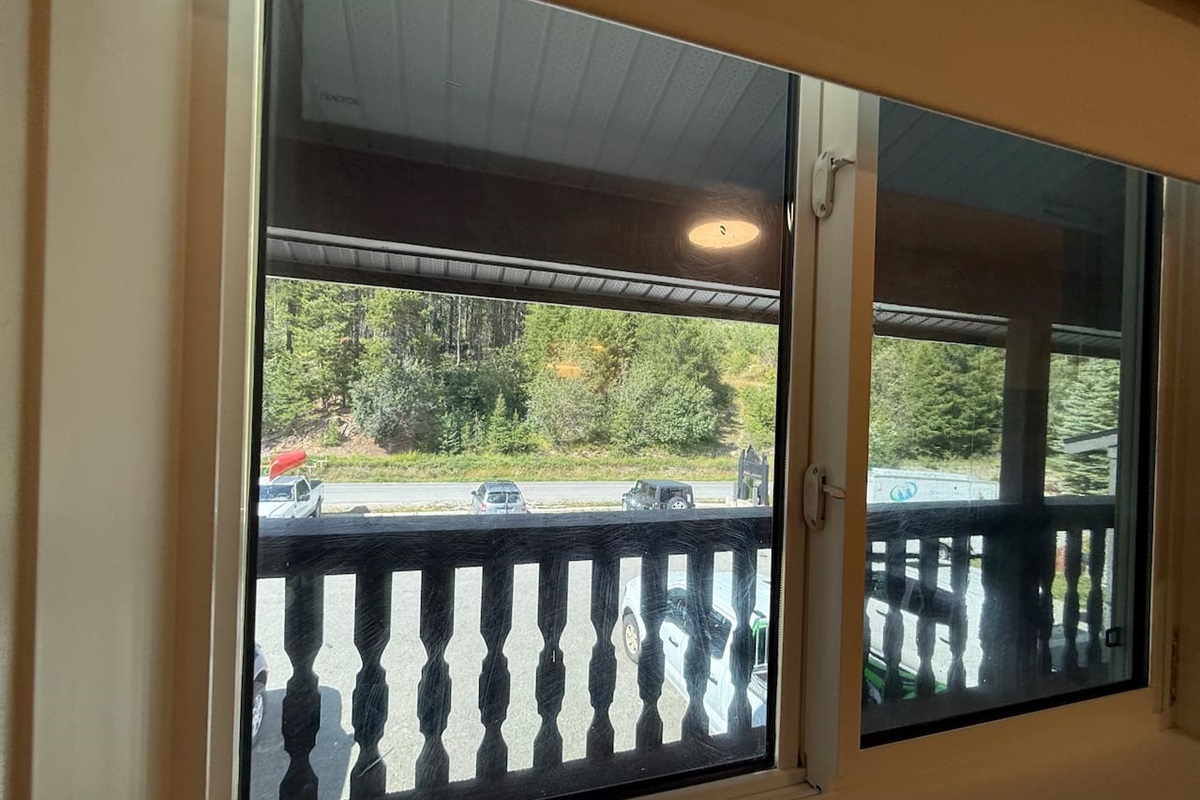 Privacy film added to the main floor bedroom so you can enjoy the view without sacrificing privacy. The room also has a blind to ensure absolute privacy when desired. 