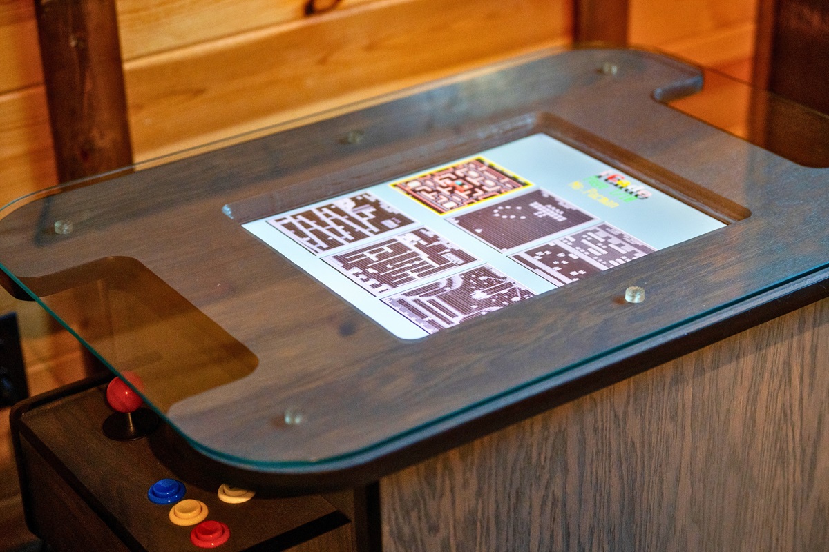 Step back in time with this retro arcade table—perfect for game nights and friendly challenges between guests.