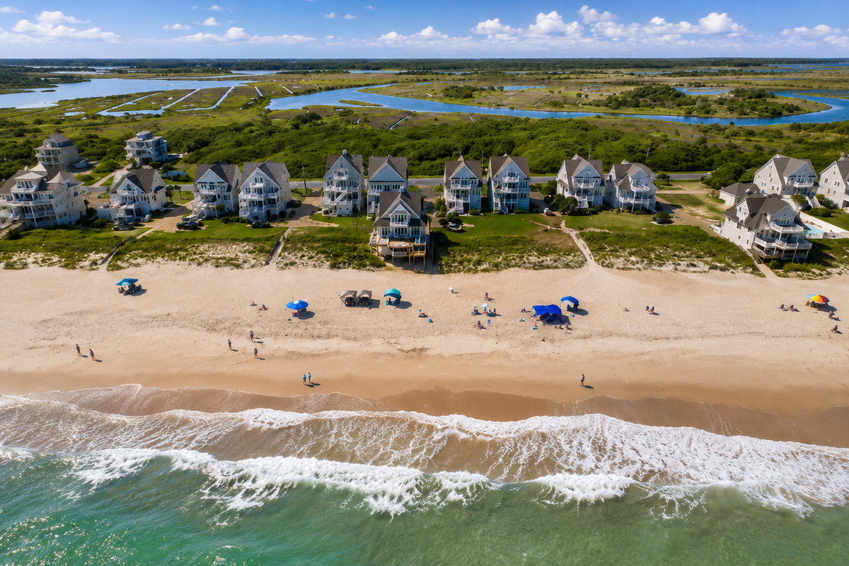 A stunning aerial view showcasing the natural beauty of the beach, ocean, and the peaceful coastal surroundings waiting to be explored.