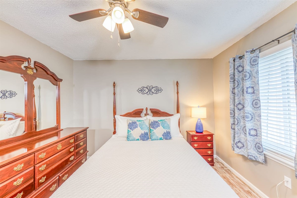 Charming Bedroom: Bright room with coastal decor, perfect for restful nights and beach adventures!