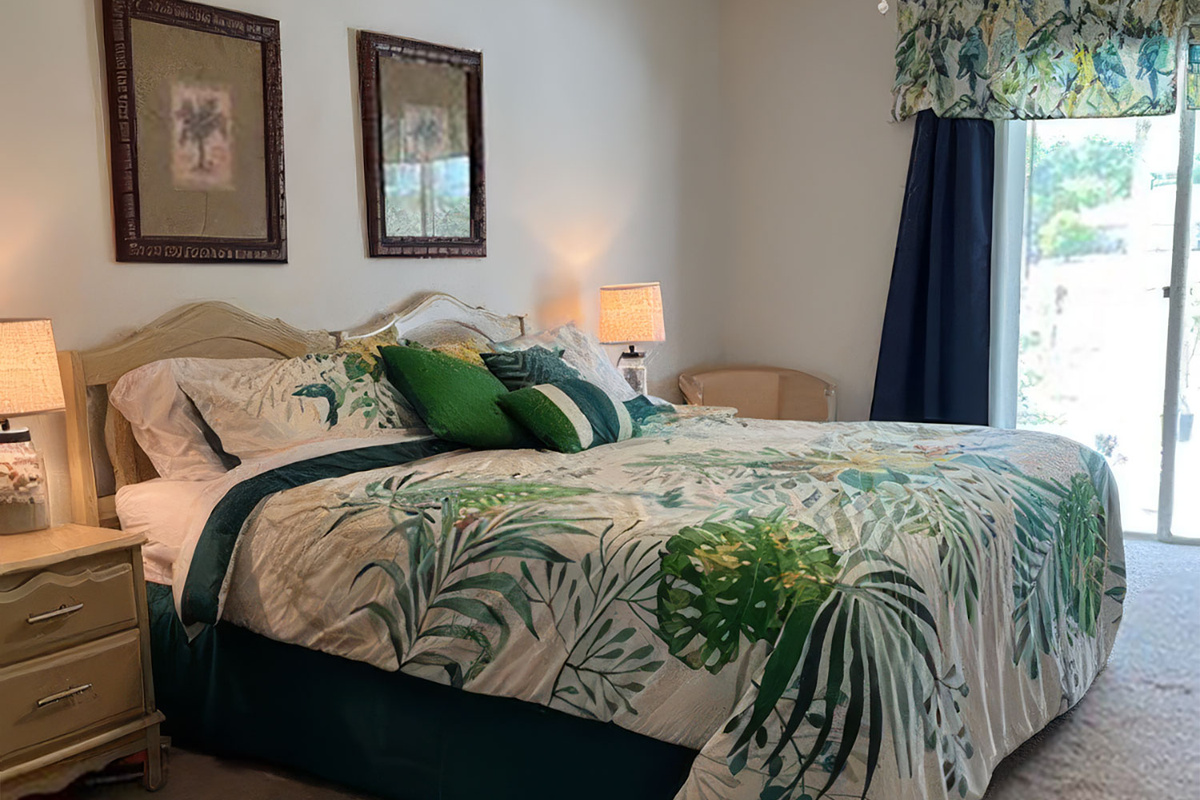 Master Bedroom with king sized bed, TV, and ensuite Bath.