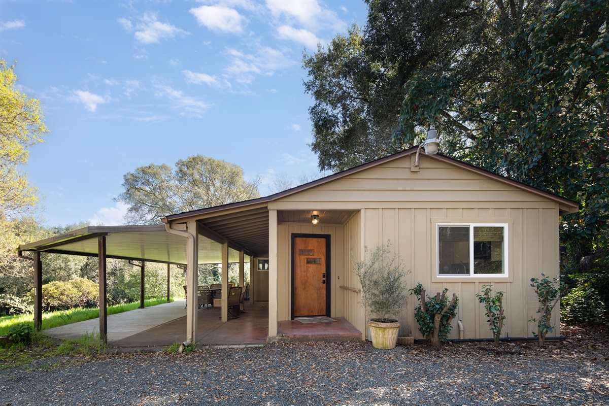Private bungalow tucked among mature trees in peaceful Bennett Valley. Covered patio entry offering shade, privacy, and a warm welcome home.