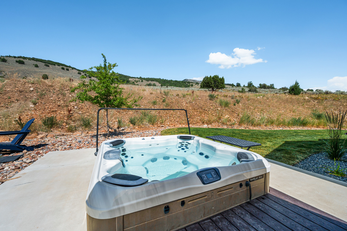 Relax in the private hot tub with scenic hillside views after a day of skiing, hiking, golfing, or exploring.