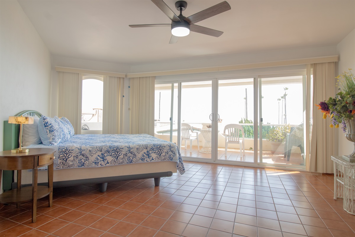 Principal Bedroom with King Bed, Fireplace, suite bathroom, and balcony.