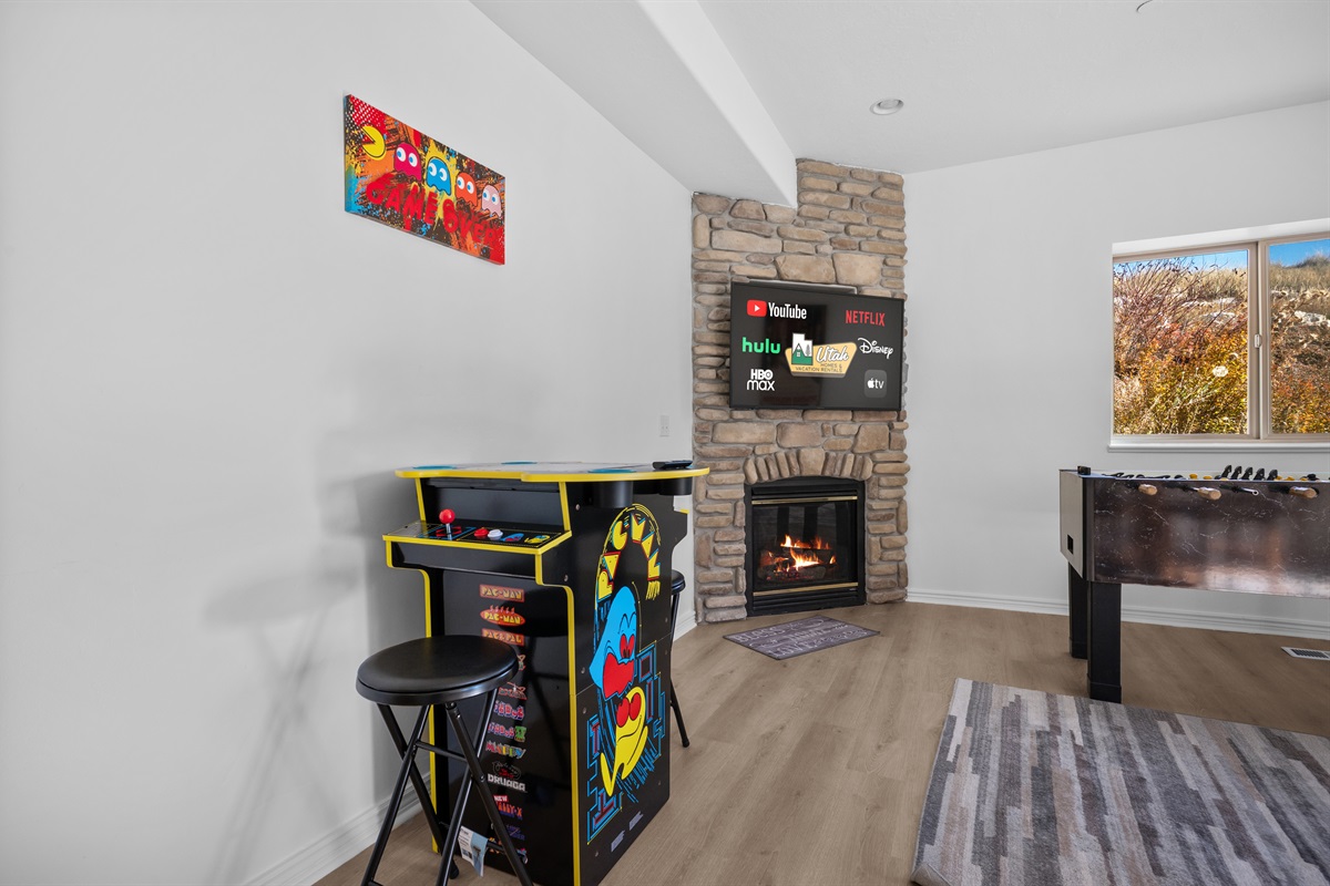 Enjoy a game of foosball or pacman  while you're watching the game or a movie with family and fiends.