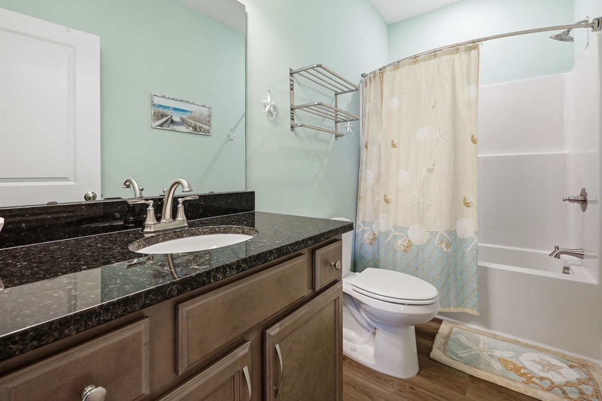 Full bathroom with tub/shower combo&mdash;perfect for families and groups