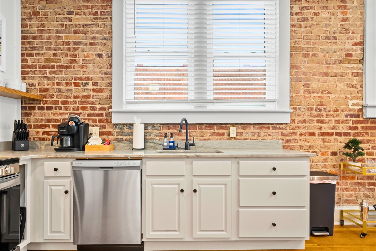 Bright and thoughtfully designed, this kitchen includes stainless steel appliances and everything you need for cooking.